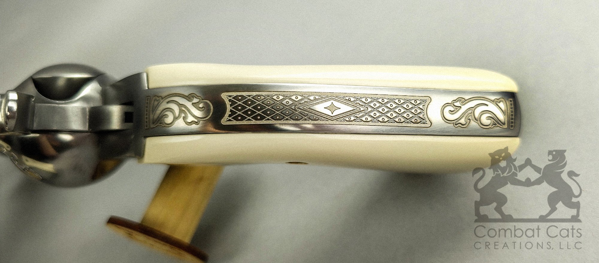Ruger Vaquero Bisley backstraps featuring intricate geometric laser engraving framed by classic scrollwork.