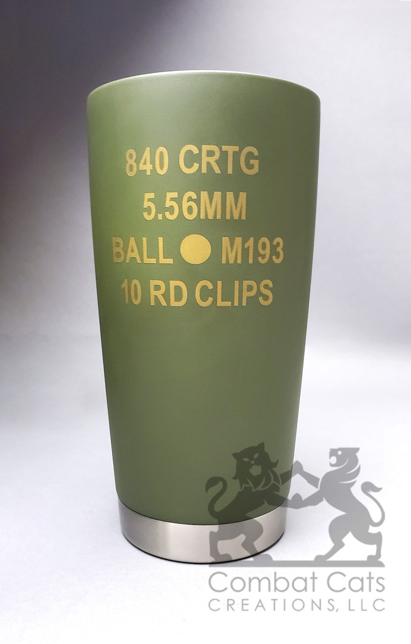 A customer-supplied tumbler transformed with a layered green and gold Cerakote finish and laser engraving inspired by classic ammunition-can markings.