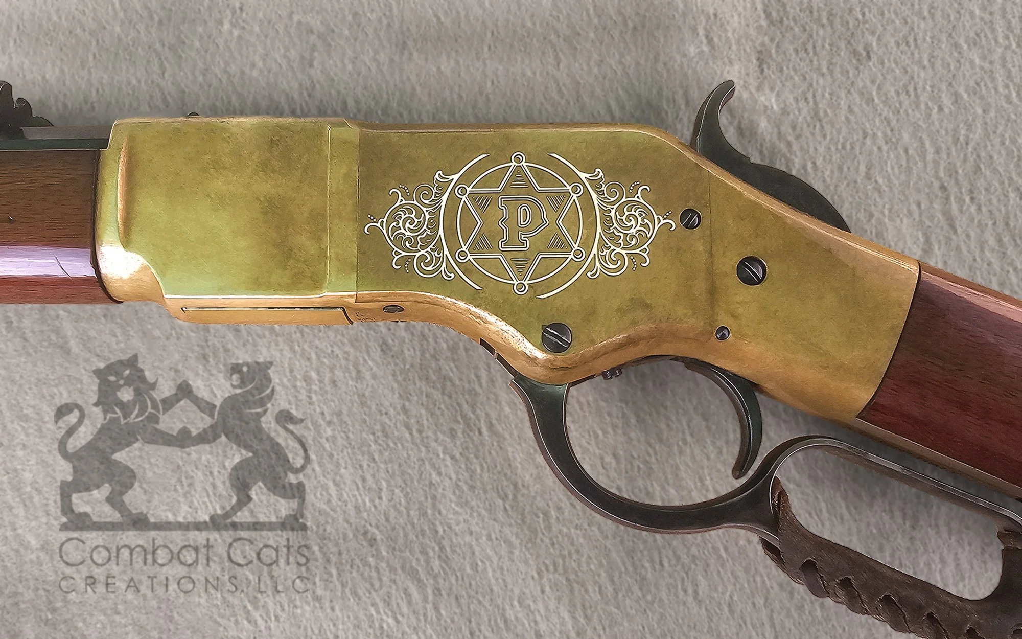 Winchester 1866 lever-action rifle featuring a personalized monogram with ornate laser engraving.