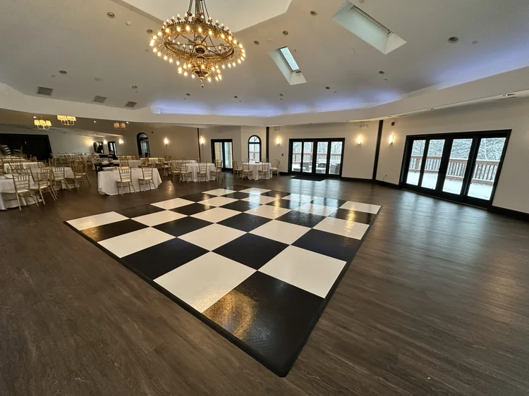 Black and white checkered dance floor in a ballroom