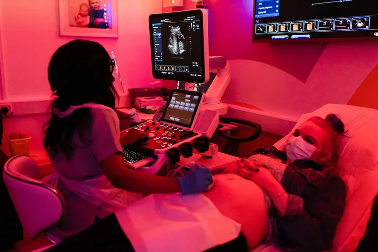 Imaginatal clinic interior, shown with baby growth scan information