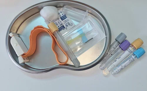 Blood collection kit with colour-coded sample tubes, tourniquet, swab, and sterile equipment for private blood tests at Imaginatal