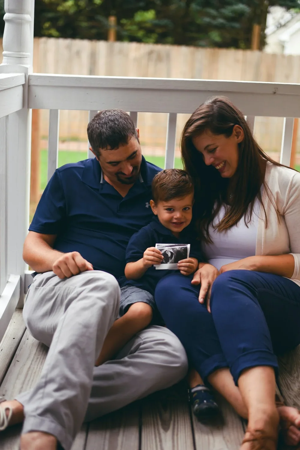 Family sharing their ultrasound photograph