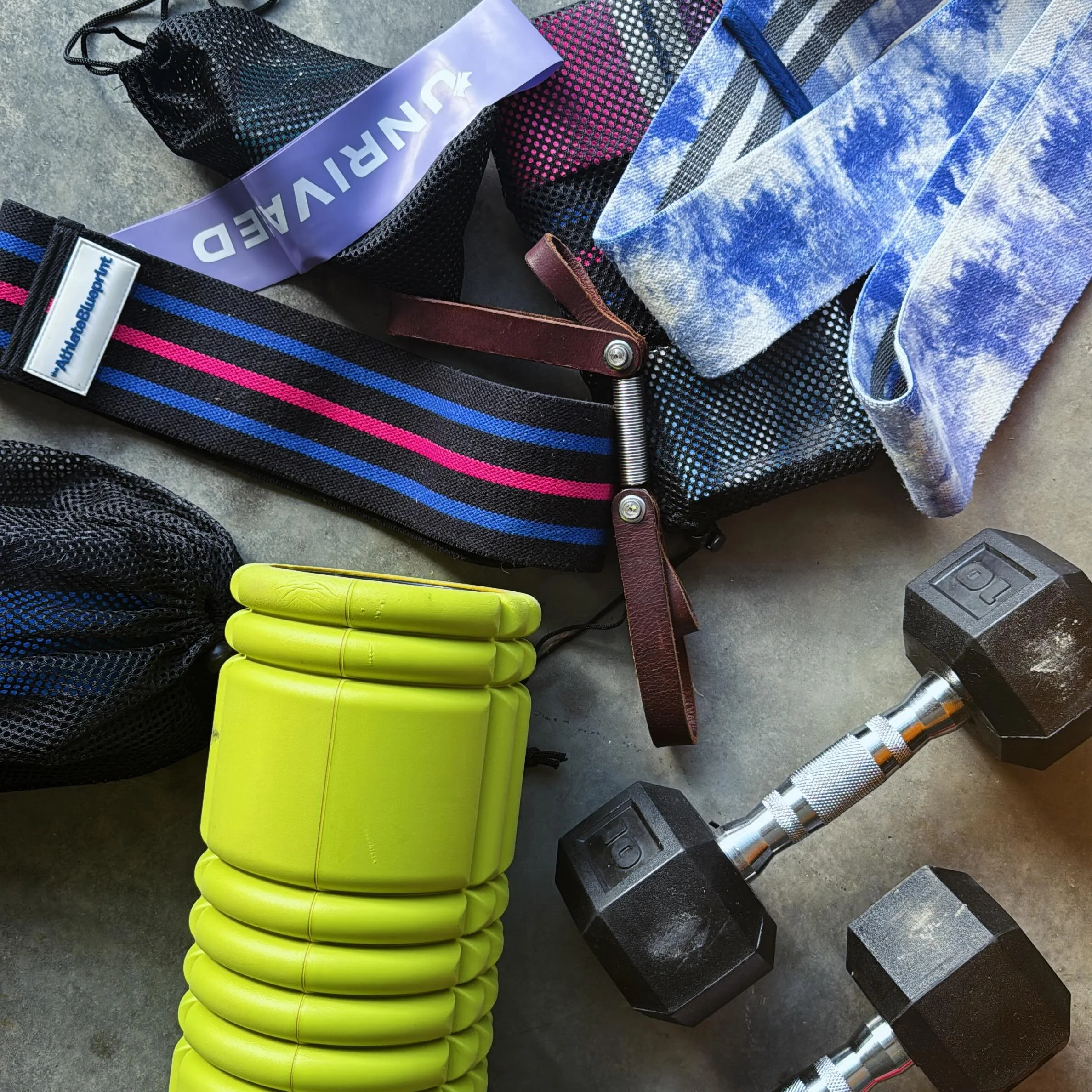 My pile so far of &ldquo;workout toys to bring on a long camping road trip adventure.&rdquo; 

Of course a mat or a towel for a grassy field or a picnic table, I can do Pilate mat workouts just about anywhere. 

What else should I bring for daily wor