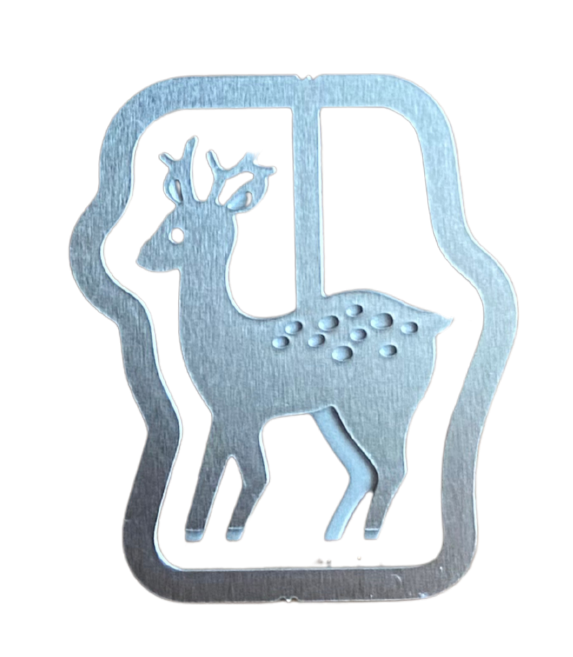 Silver paperclip in the shape of a reindeer with antlers.