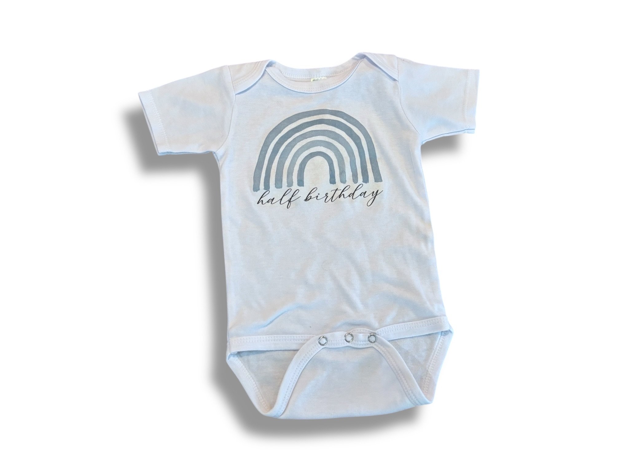 Size 6-12 month Laughing Giraffe white “half birthday” onesie w/ blue rainbow