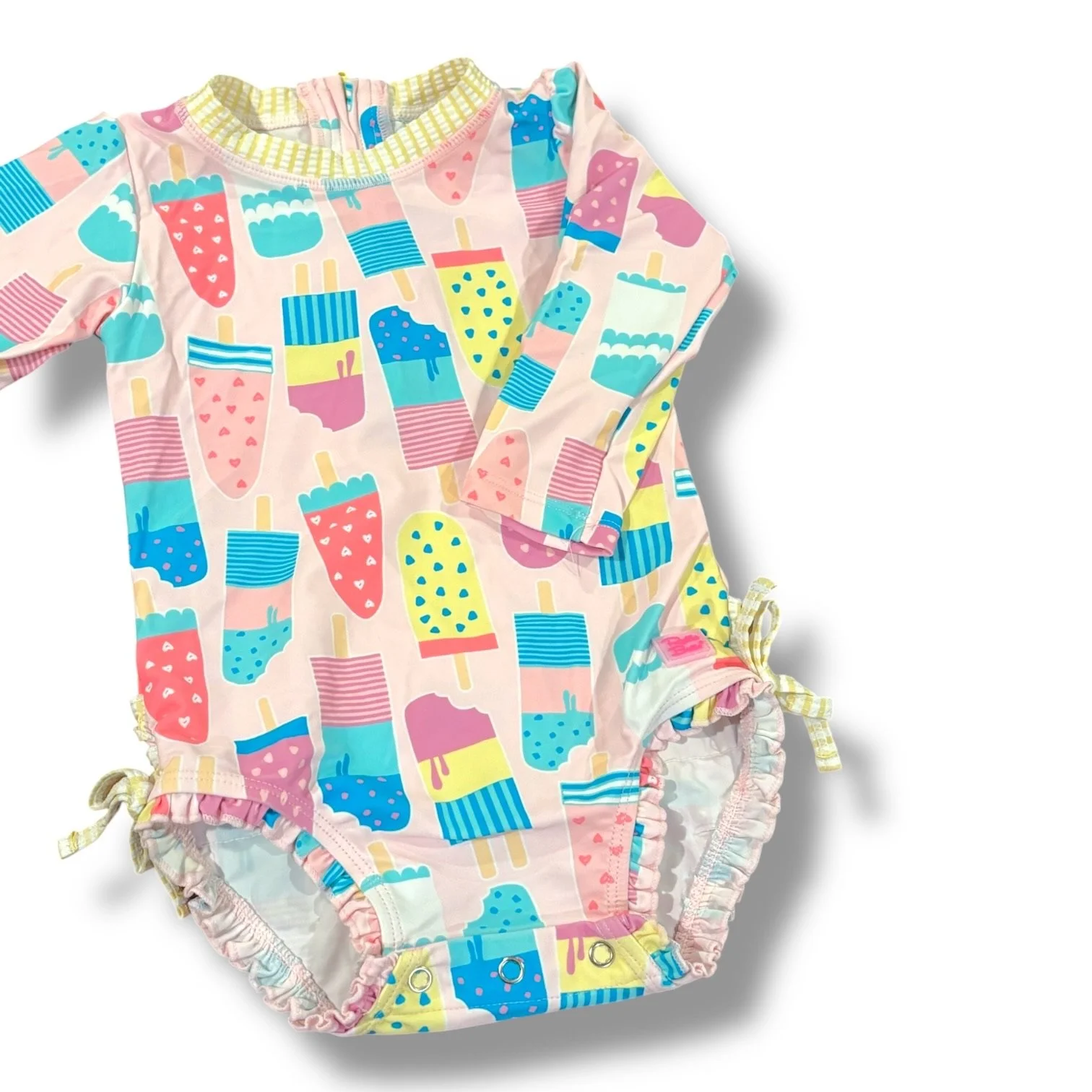 Size 18-24 month Ruffle Butts pink rashguard swimsuit w/ popsicles, yellow/white trim