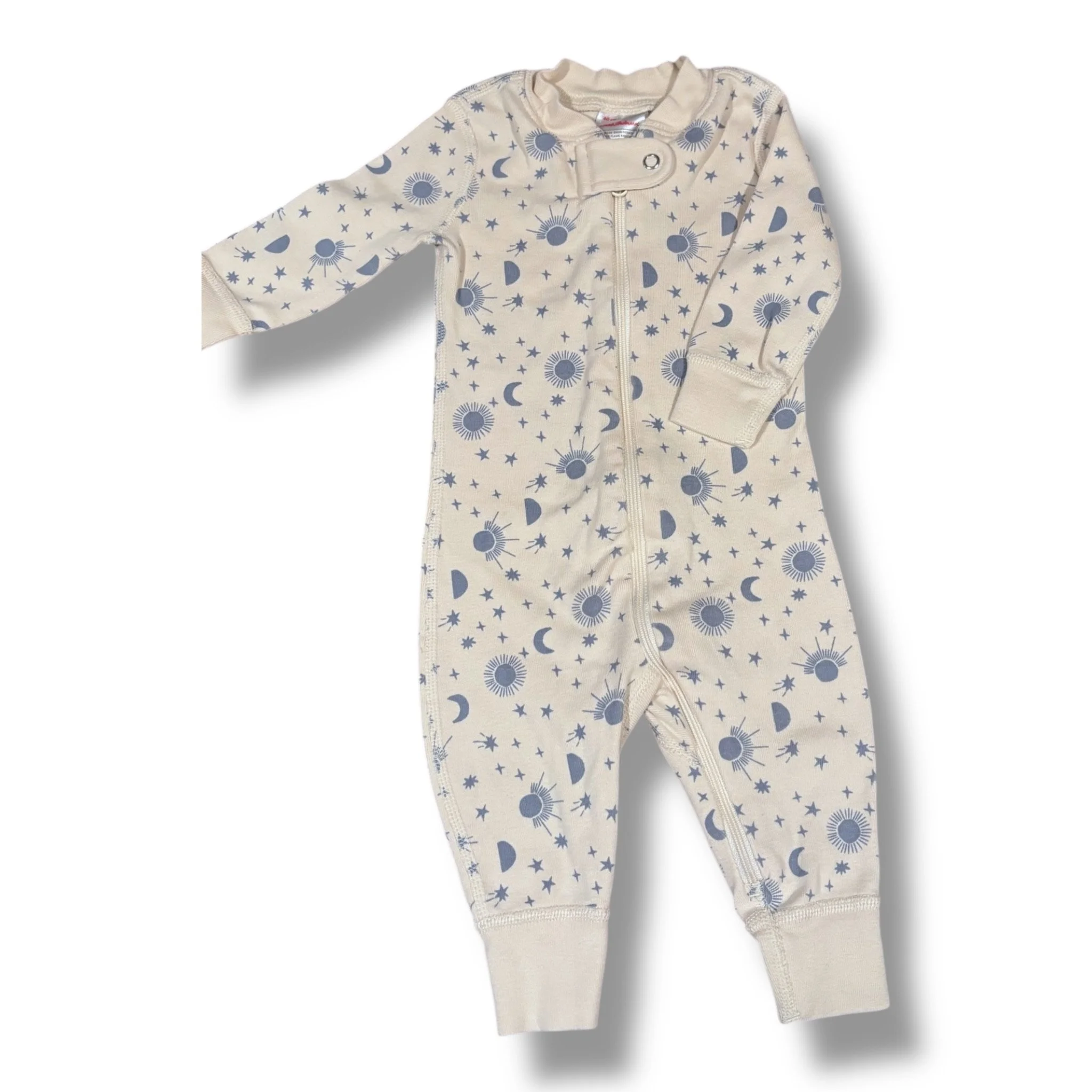 Size 3-6 month Hanna Andersson cream pajamas w/ blue suns, moons, stars