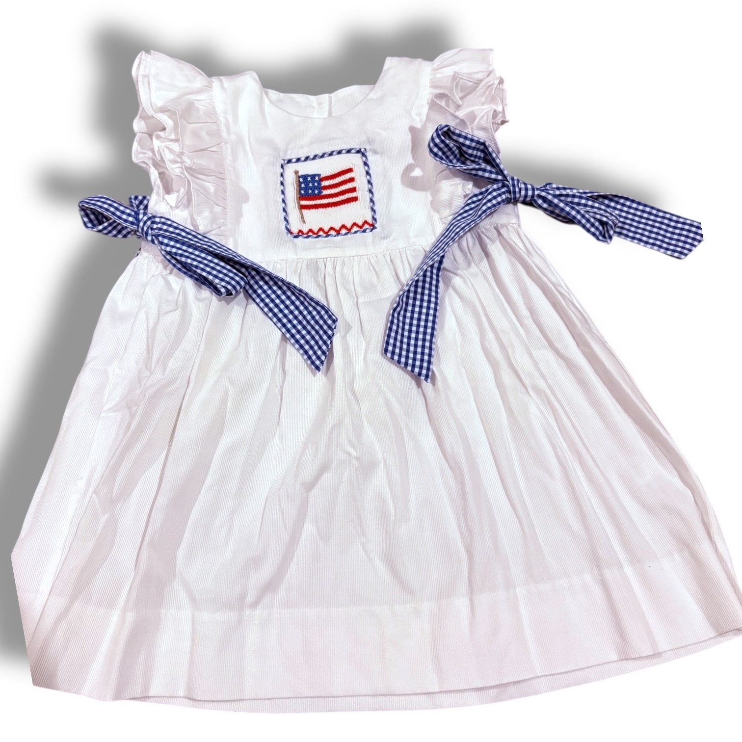 Size 24 month Stitchy Fish white corduroy dress w/ smocked American flag, blue/white gingham side bow