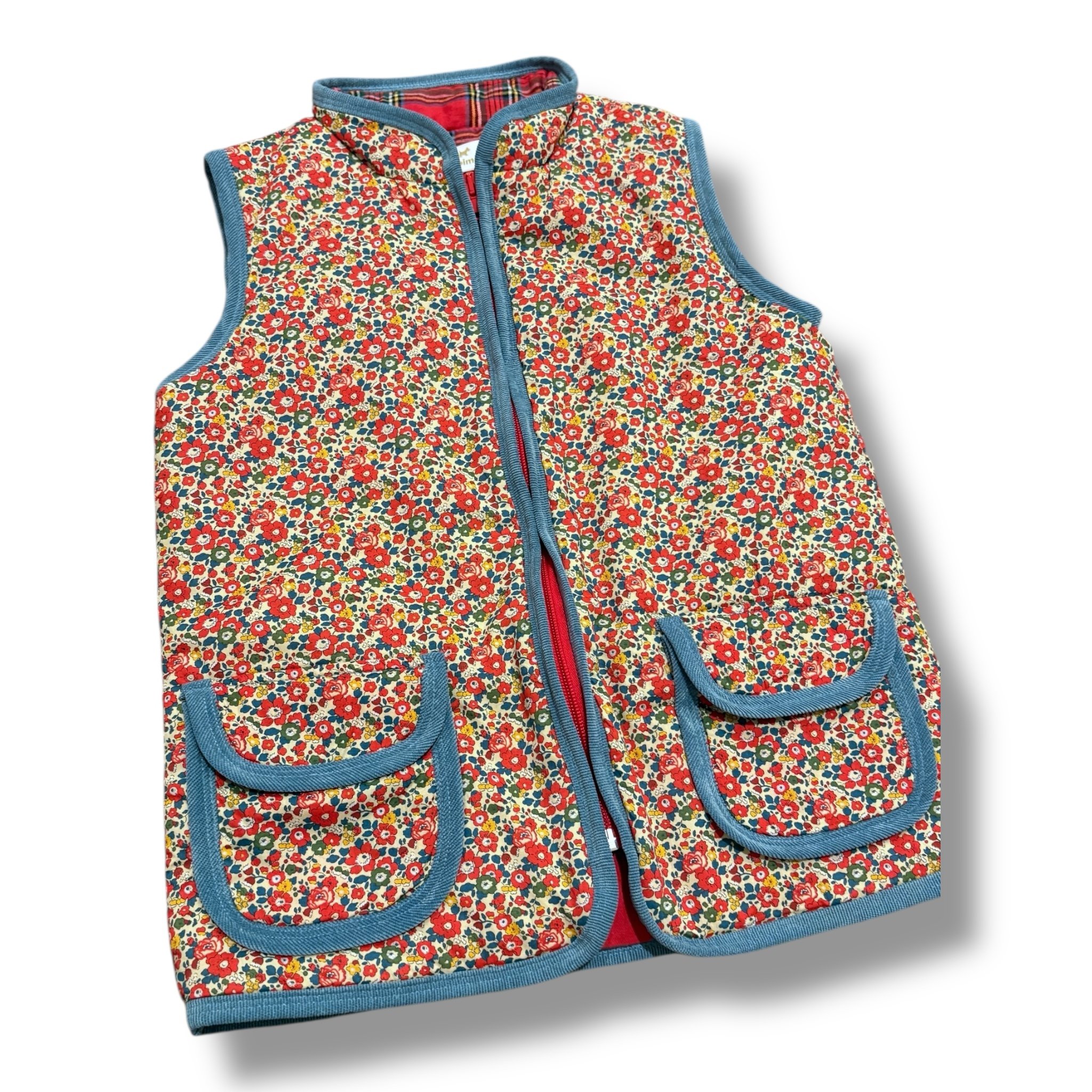 Size 10 Sal and Pimenta floral vest w/ blue trim, red plaid lining