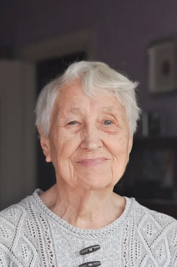 portrait-elderly-woman-near-window-grandmother-smiling-portrait-elderly-woman-looking-out-window-grandmother-smiling-339392527.webp