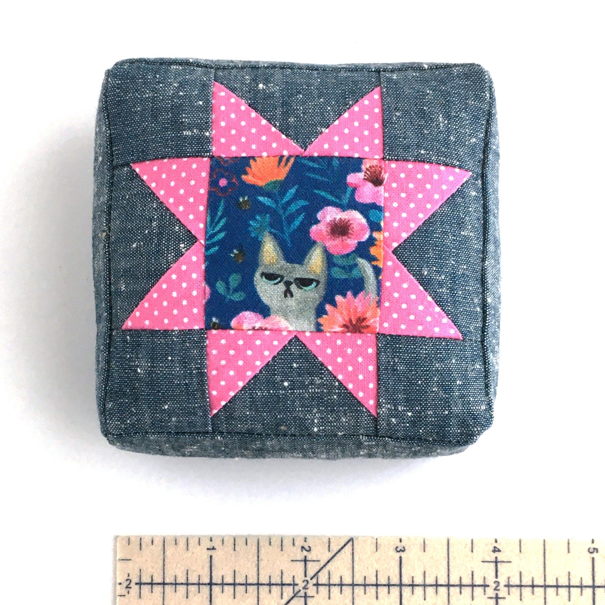 Cat pincushion to make using the Sawtooth Star Pincushion pattern.