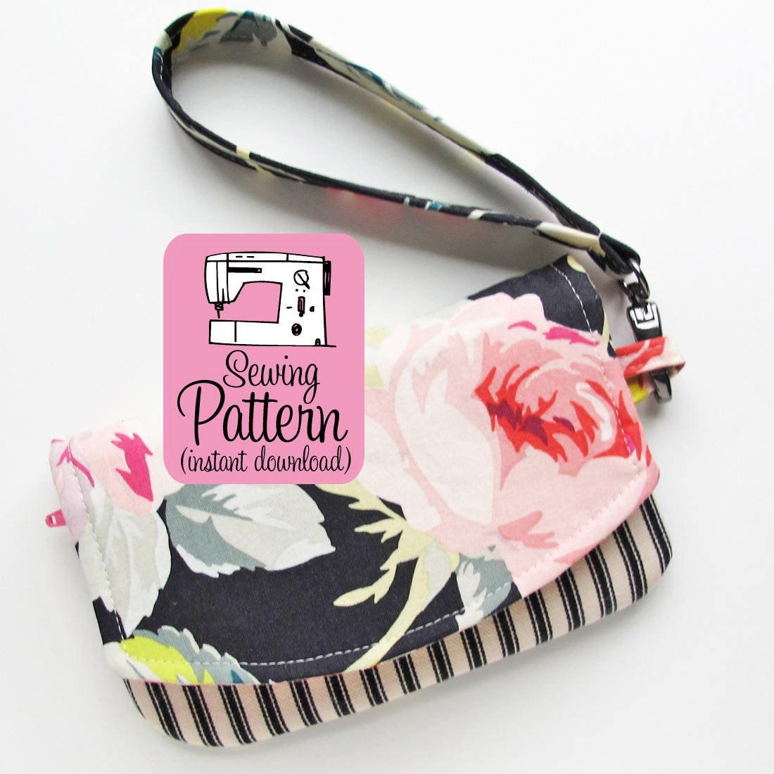 The smaller Zip Pocket Pouch Wristlet made from a large scale floral print fabric and black ticking fabric.