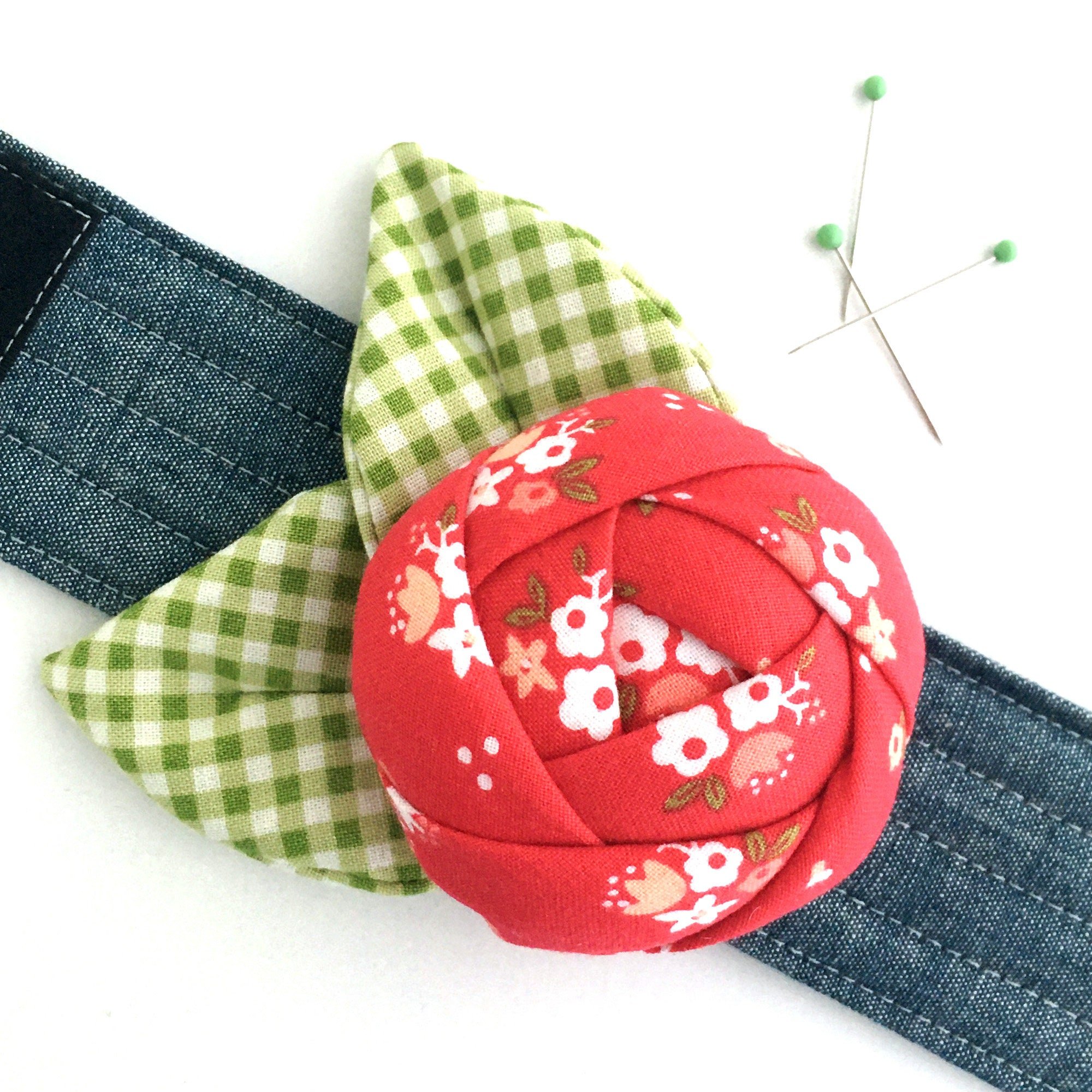 Rose Pincushion Cuff close up of flower with sewing pins.