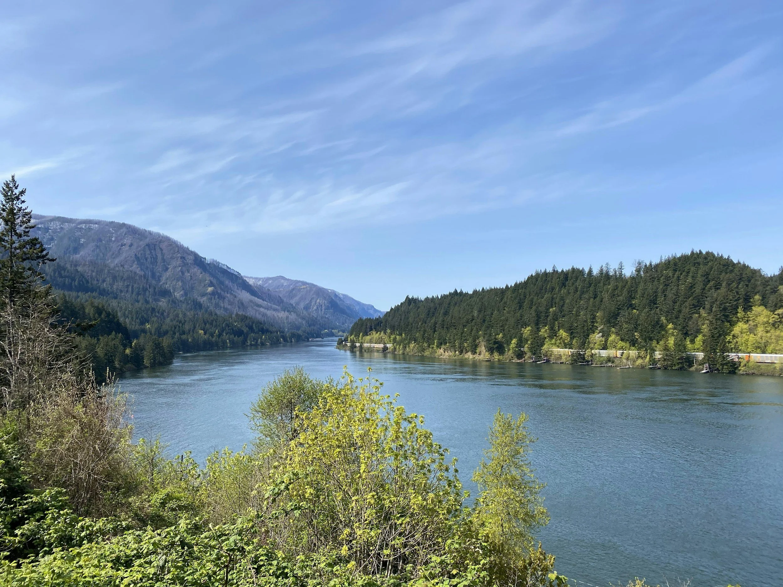 A wide river runs through hills