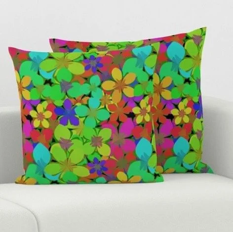 Colorful throw pillows in Green Garland fabric