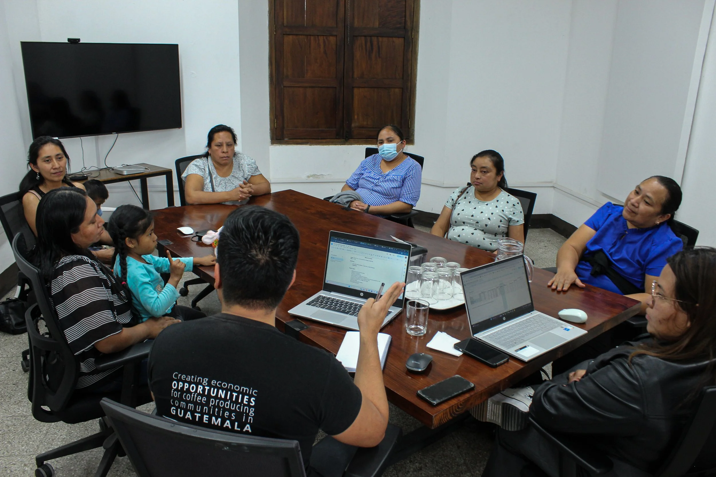 DLG group meeting with women's parter cooperative | donate to our work as we turn each coffee harvest into impact