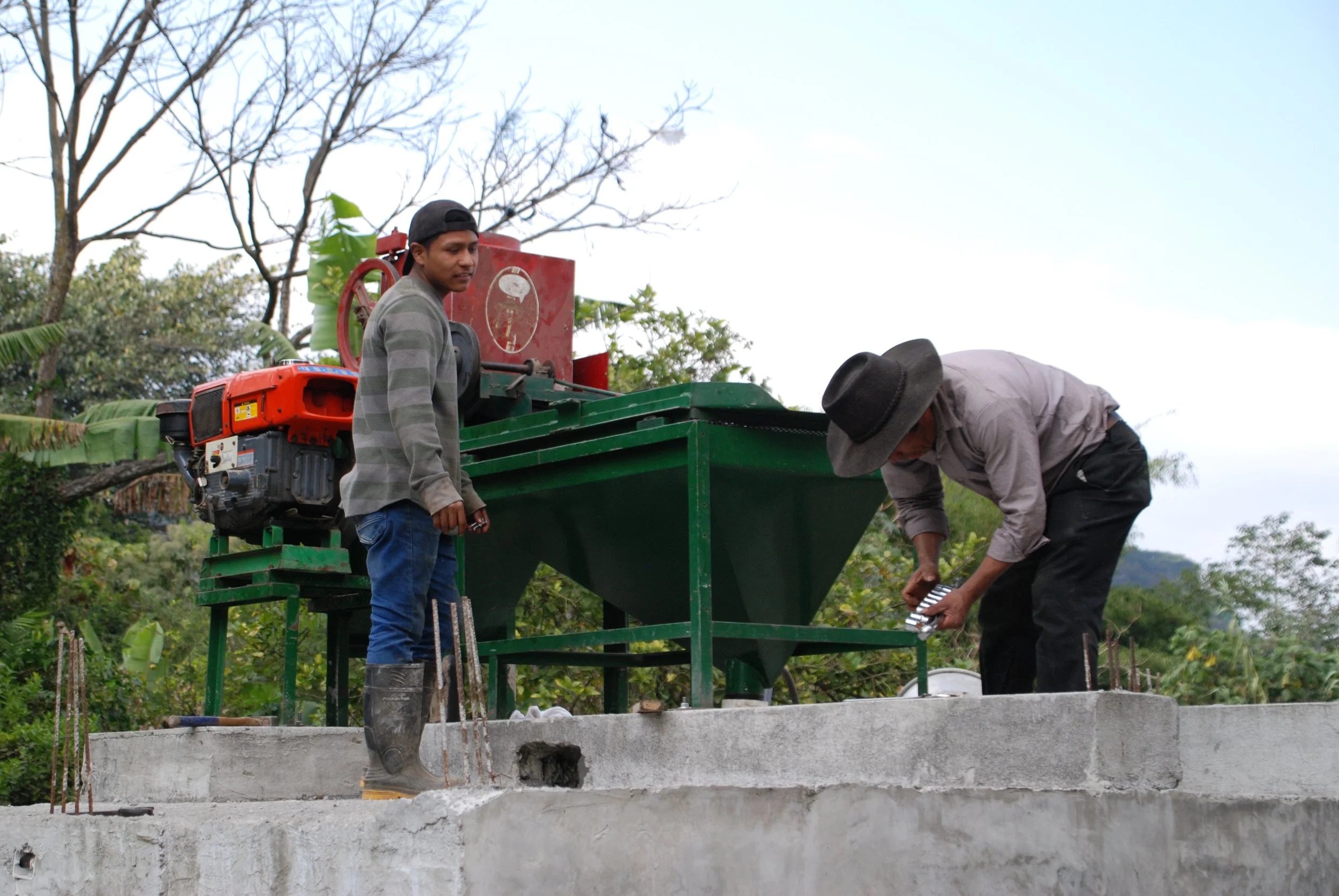 Coffee producers in Guatemala using depulper machine