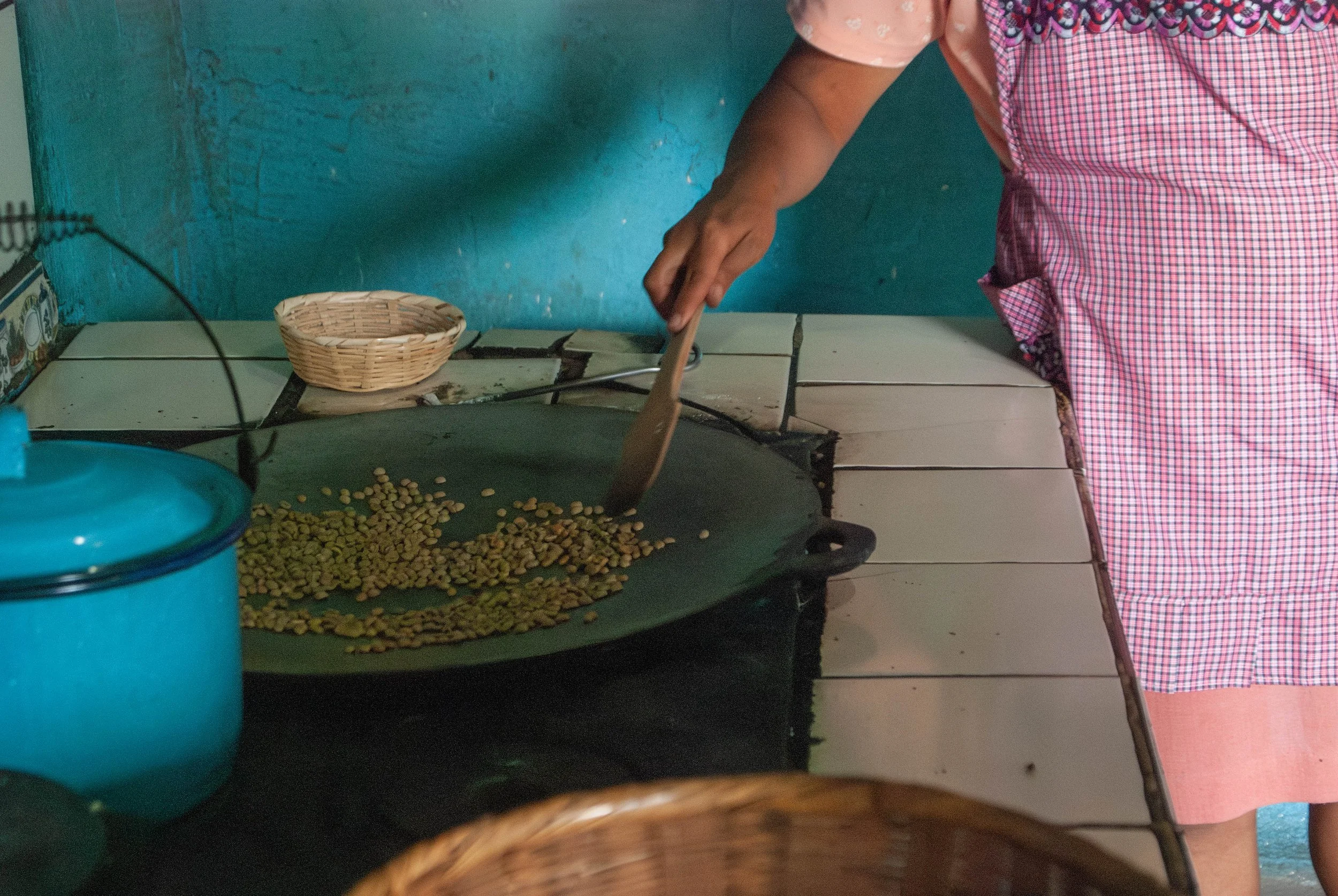 coffee moments - artisanal coffee roasting in Guatemala on a comal; coffee connects through heritage
