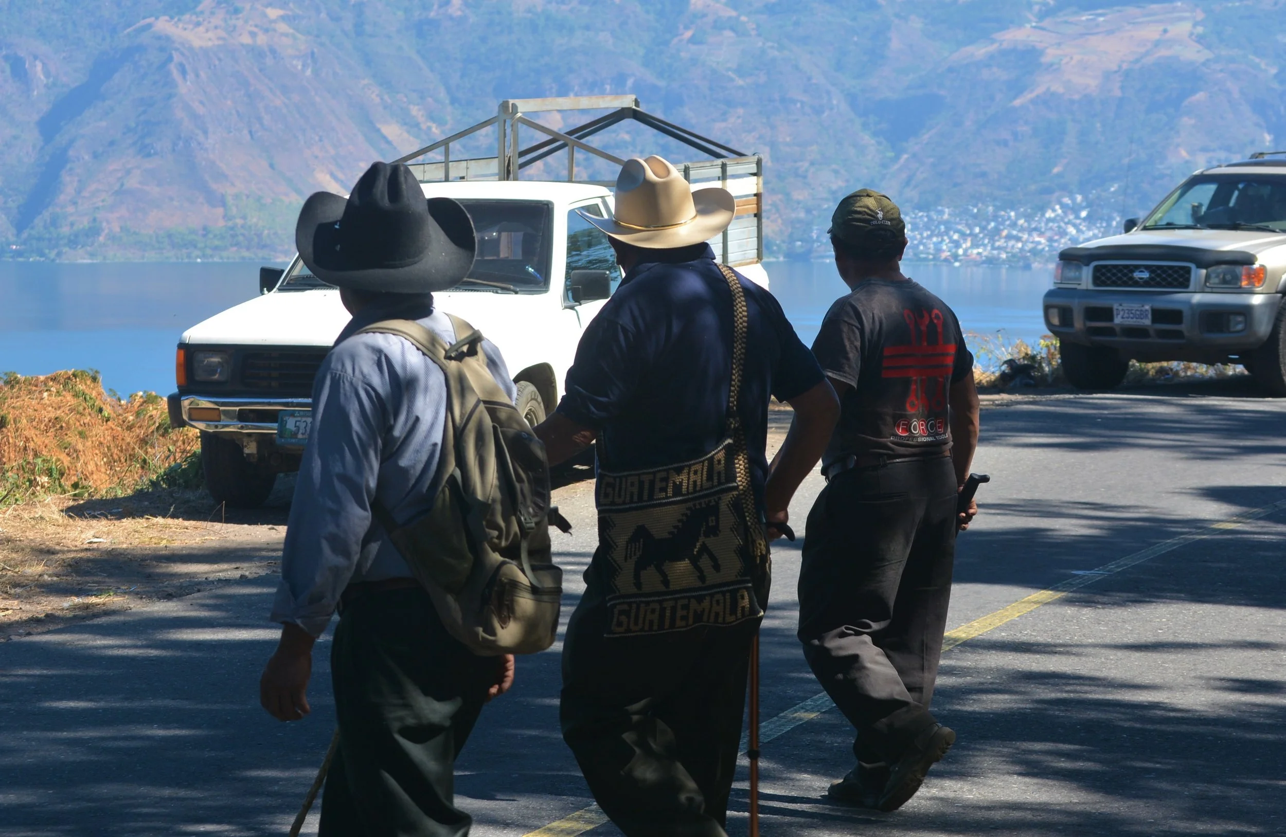 Indigenous farming community members looking at Lake Atitlán, Guatemala | tradictional farming