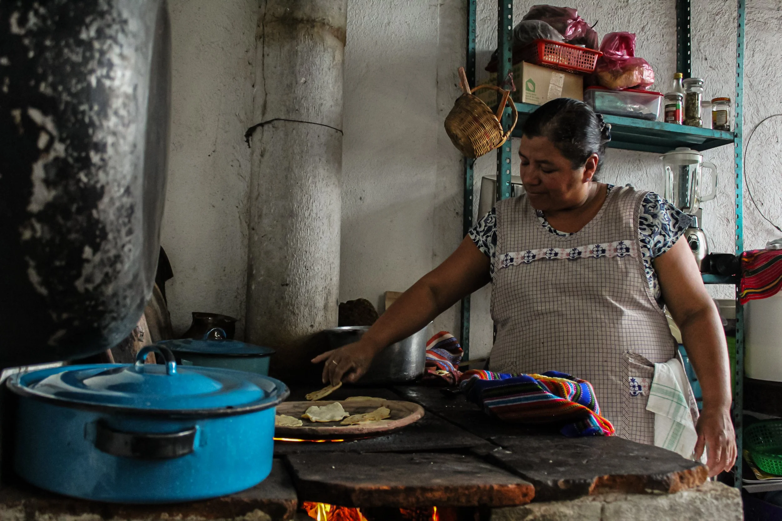 Guatemalan tortillas being made on comal griddle | Guatemalan cuisine