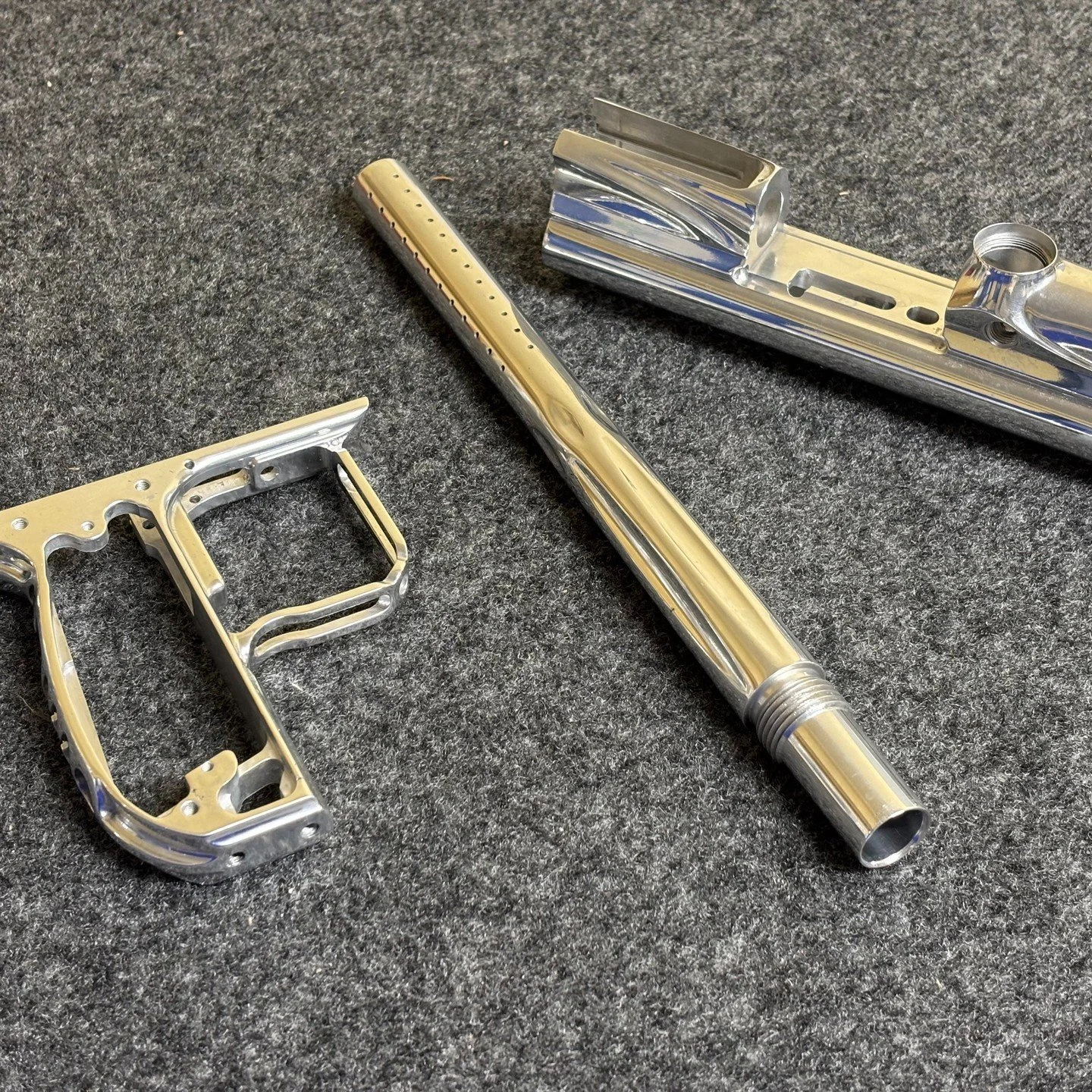 Surface preparation is key. One of our customers recently sent us this paint ball marker that they had meticulously polished. This made anodising so much more effective and ensured a high gloss finish. A custom colour (deep orange) was applied which 