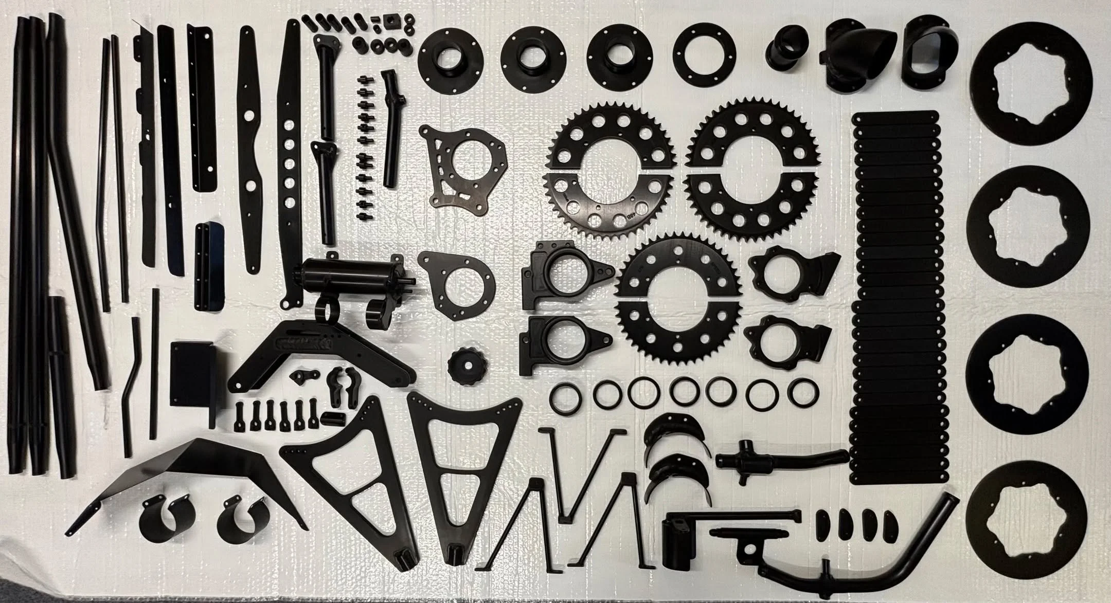 133 x race car parts anodised within a week, cost effectively and to a very high standard. The final finish was a deep glossy black; aesthetically pleasing and highly durable.