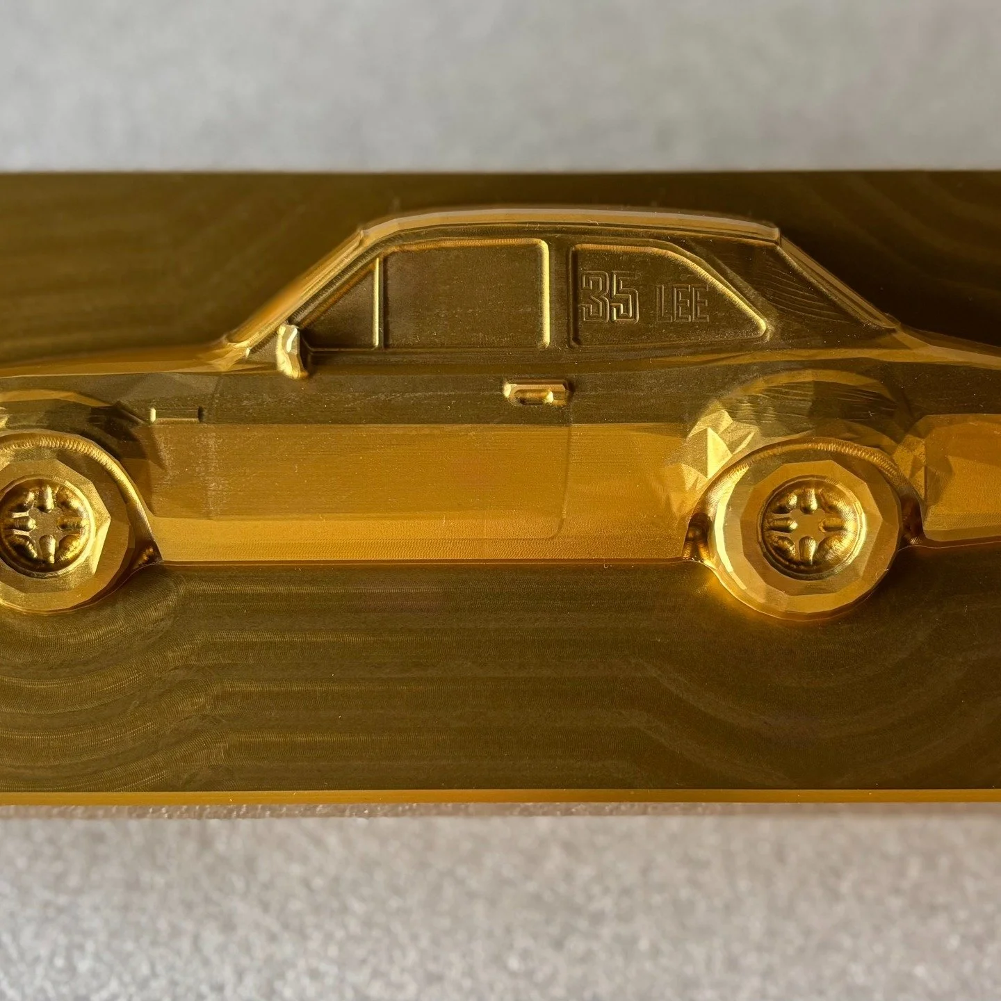 A trophy finish: 1 x beautifully machined work of art, anodised gold! This personalised car was machined out by a very thoughtful - and highly precise - local machine shop to celebrate one of their hardworking team members. 

What could you or your c