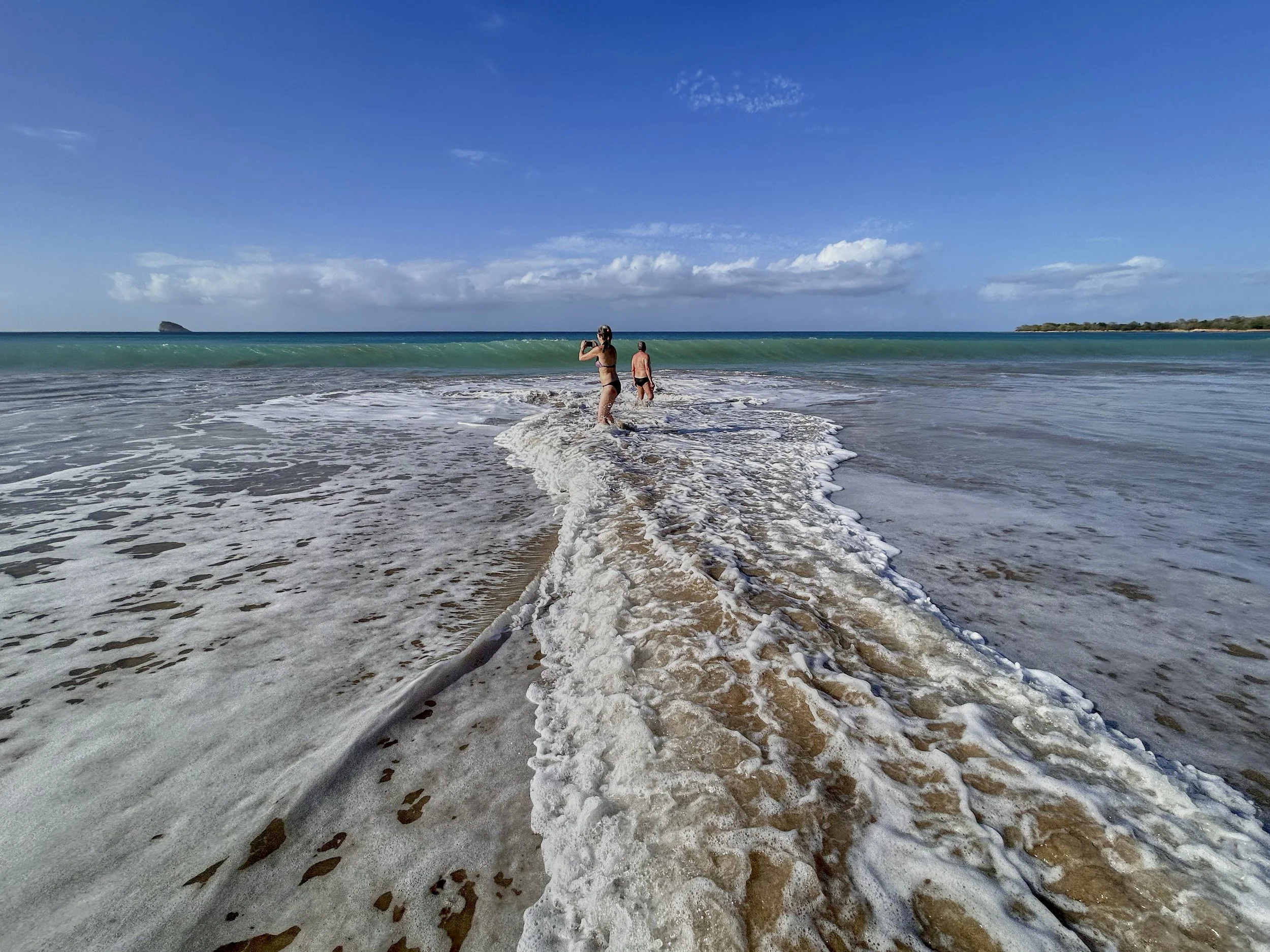 Claudia, braving the waves for the perfect shot!