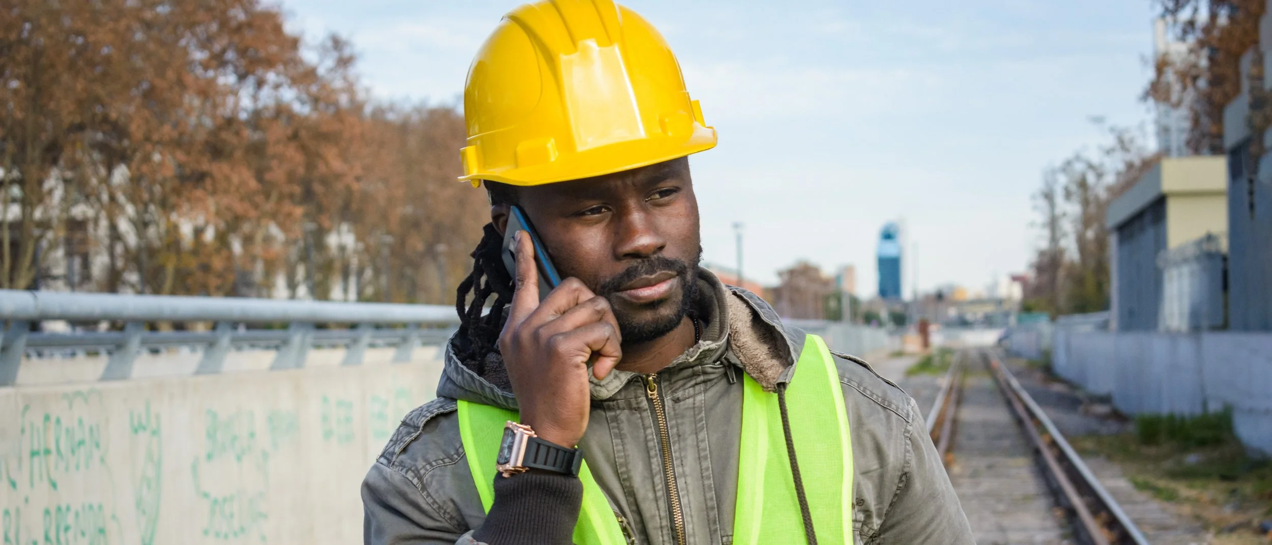 african-ethnicity-builder-man-banner-talking-on-ph-2023-11-27-05-00-56-utc.jpg