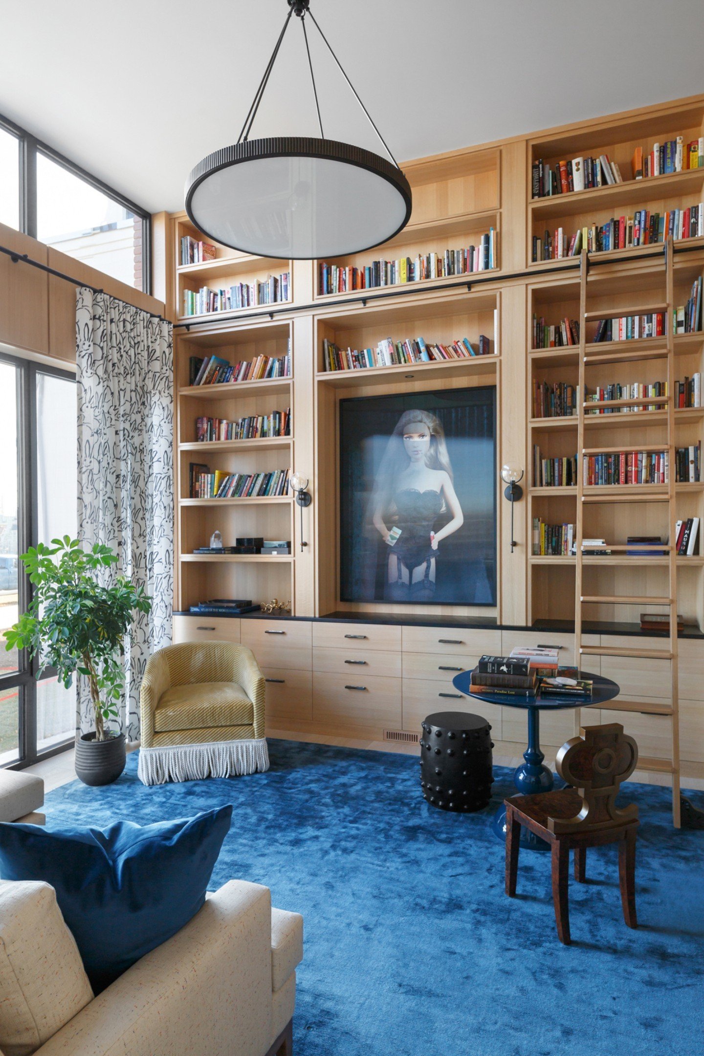 Welcome to the library from our #IHRosedaleResidence project! Custom floor-to-ceiling millwork, a curated collection of eclectic furniture, and whimsical fabric finishes come together to create a space that is both sophisticated and delightfully uniq