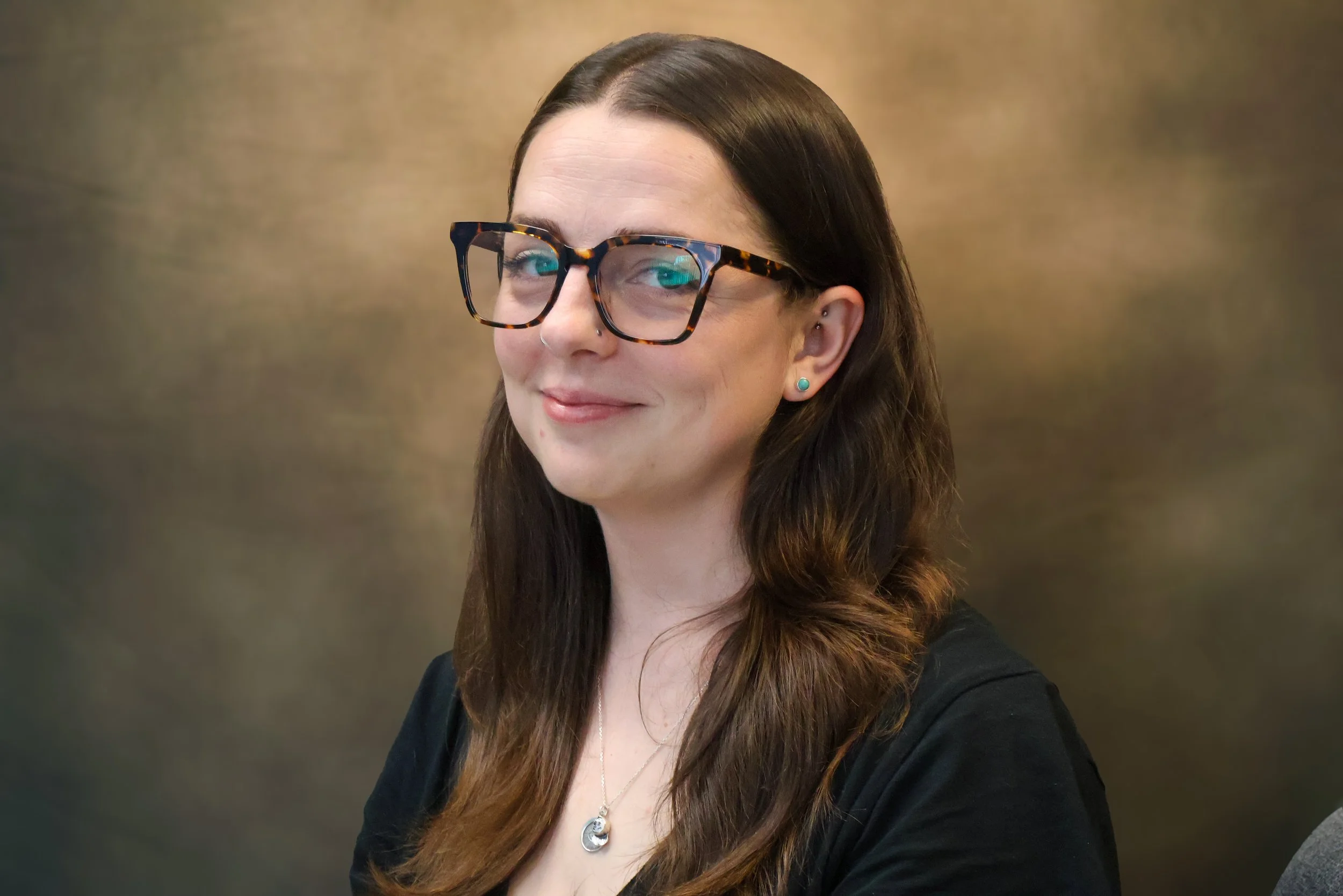 Default user icon with a circular head and shoulders outline on a light gray background.