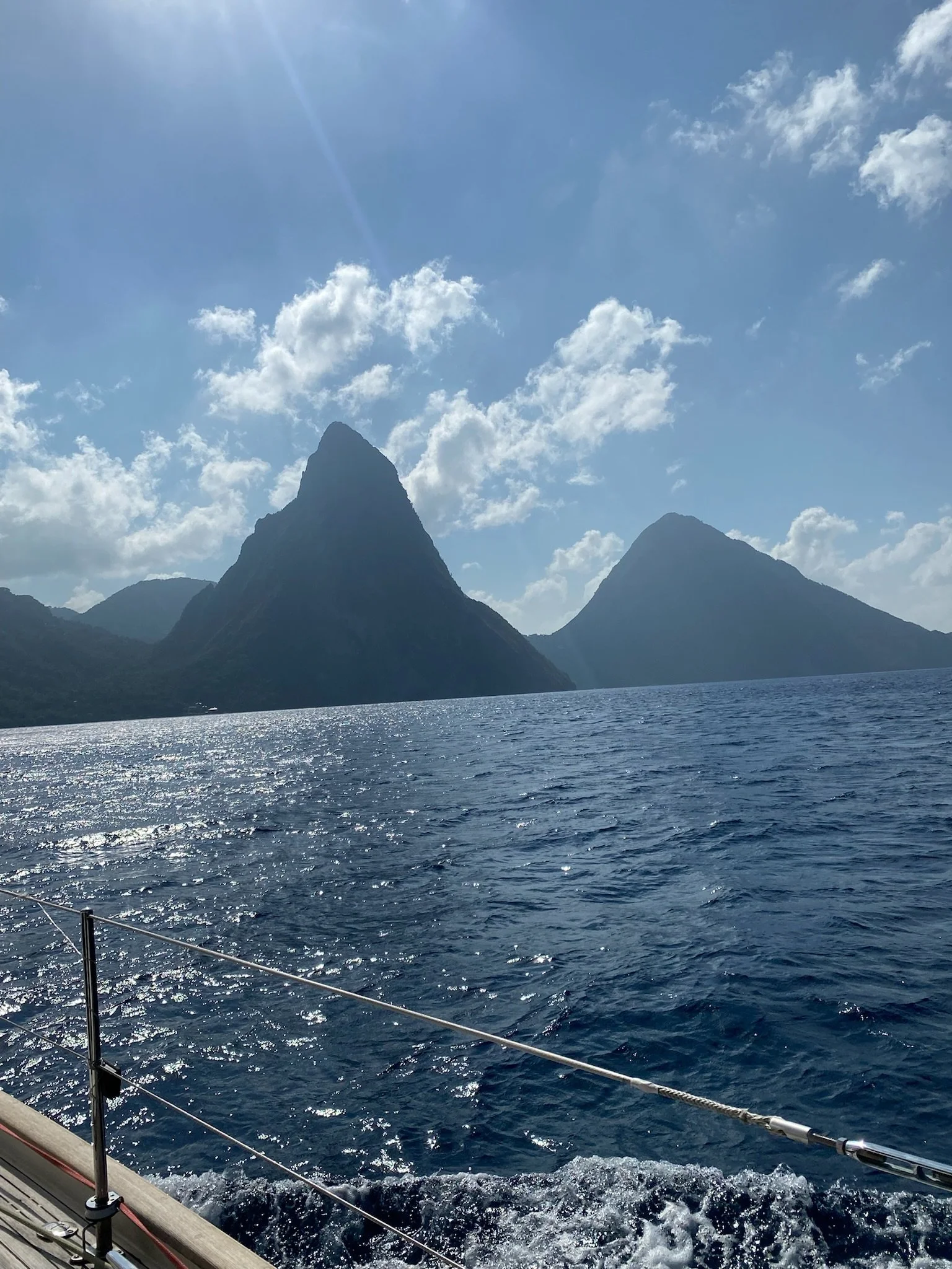 View of the Pitons, two mountainous volcanic spires on the southern end of St. Lucia, from Grace. Gros Piton stands 798.25 m high, and Petit Piton 743 m high; they two are linked by the Piton Mitan ridge.