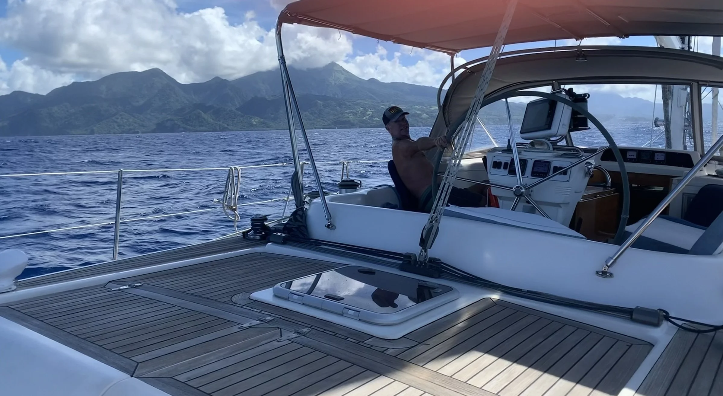 Rolling seas at our back and now sailing parallel to Martinique- Saint-Pierre bound to clear customs.