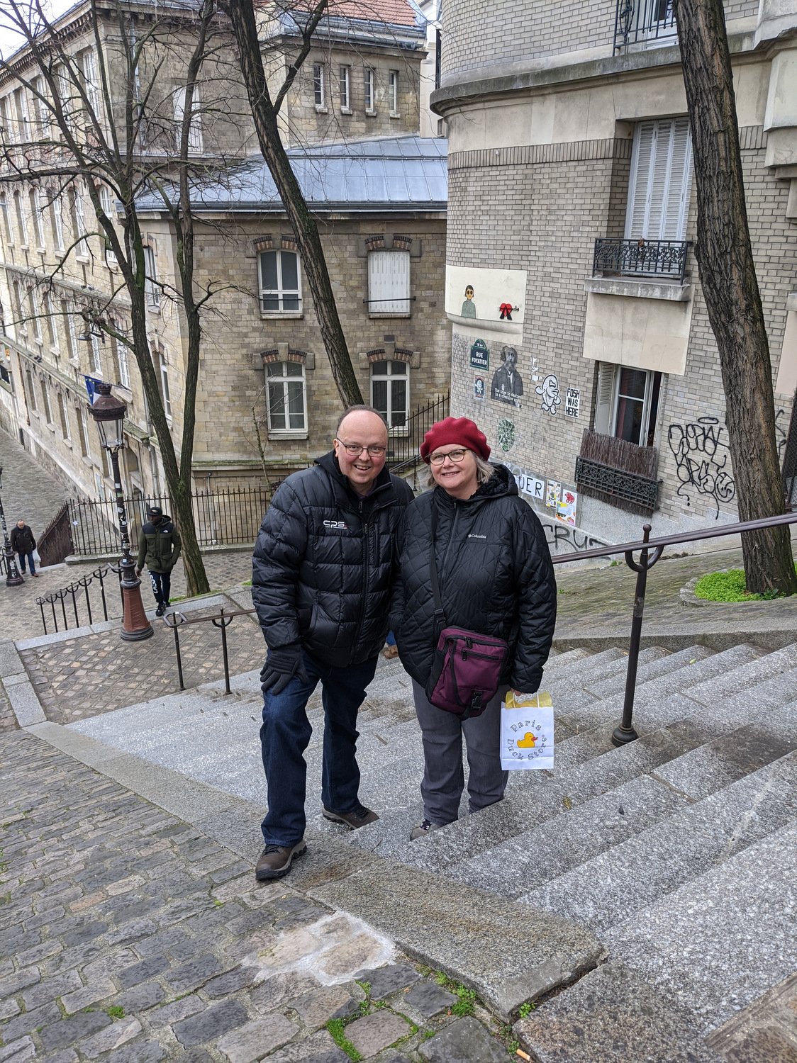 Debbie and John climb the Montmartre stairs
