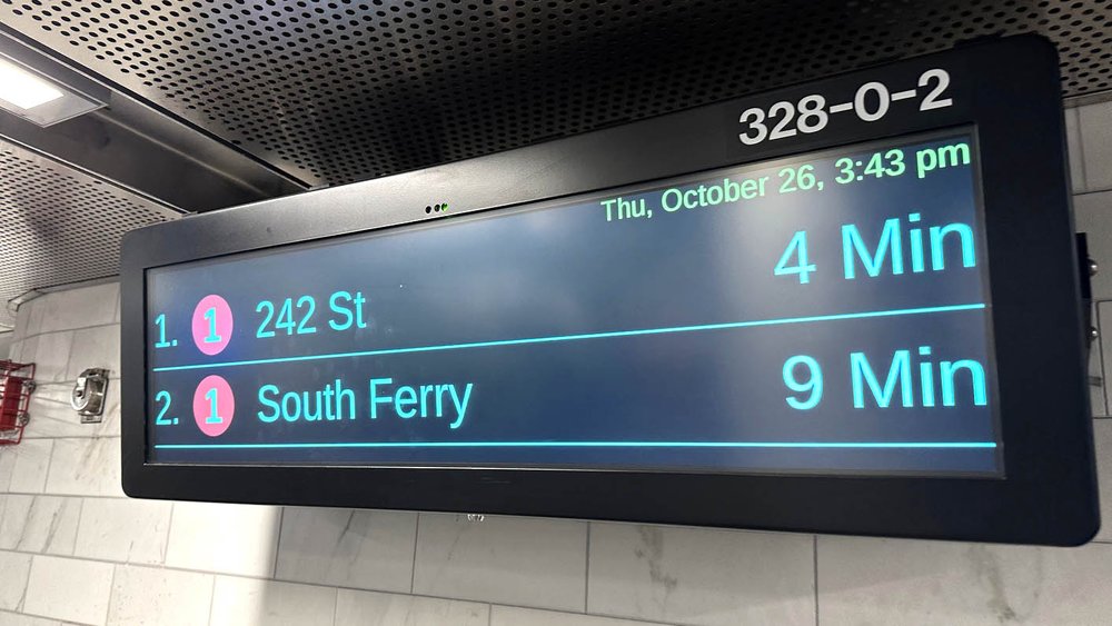 Digital signs indicate the next arriving trains.