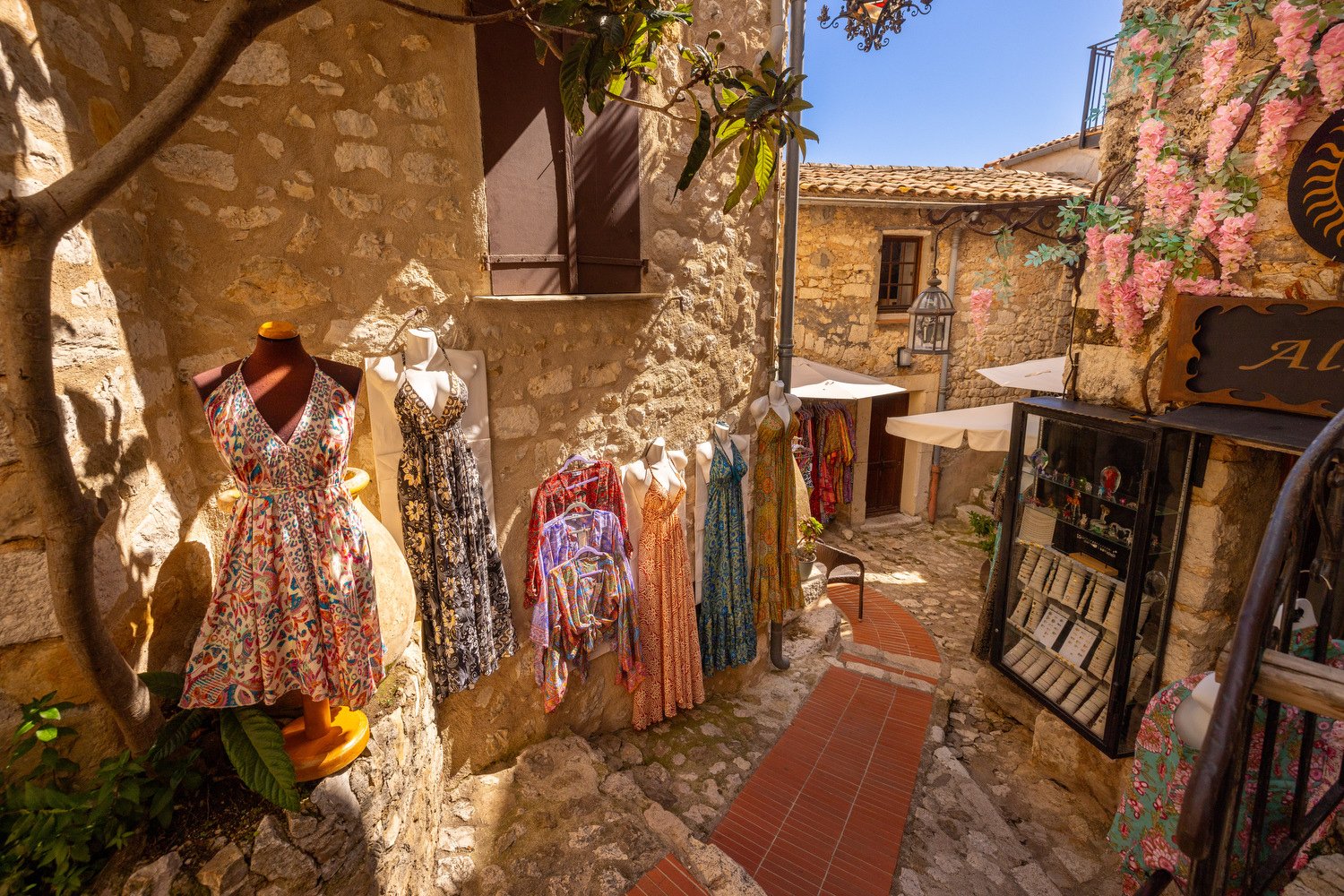 A dress shop displays its clothing. 
