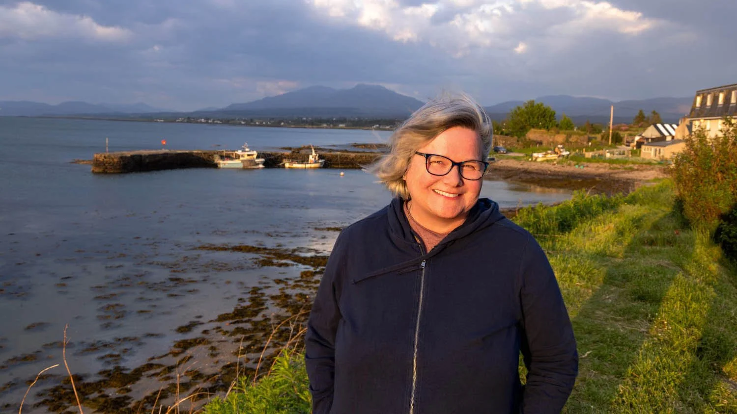 Debbie takes in the sunset directly across the street from our  hotel in Broadford. 