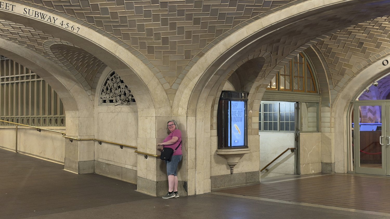 Debbie whispers into the corner at the Whispering Gallery. 