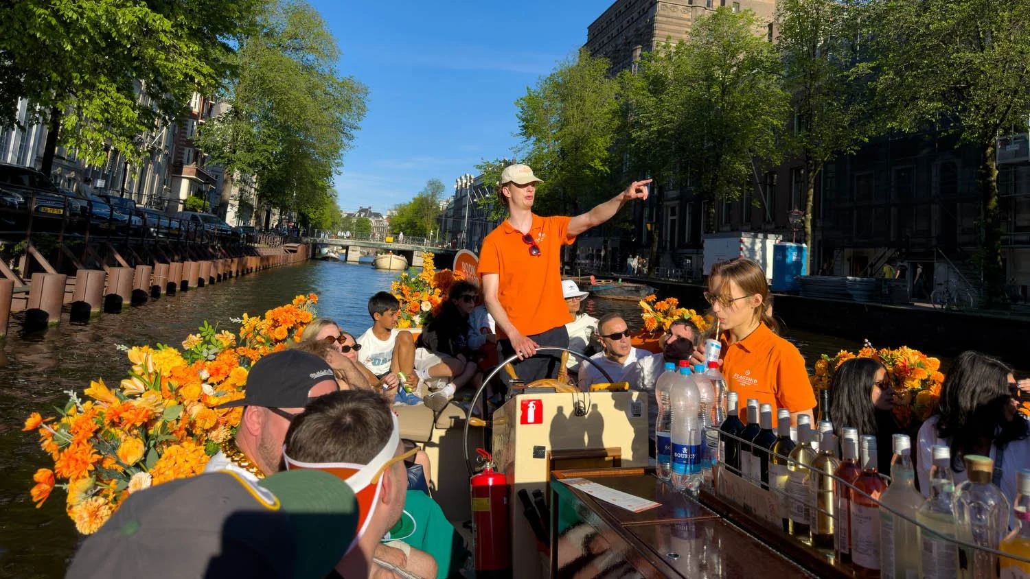 Our guide points to an attraction on our canal cruise.