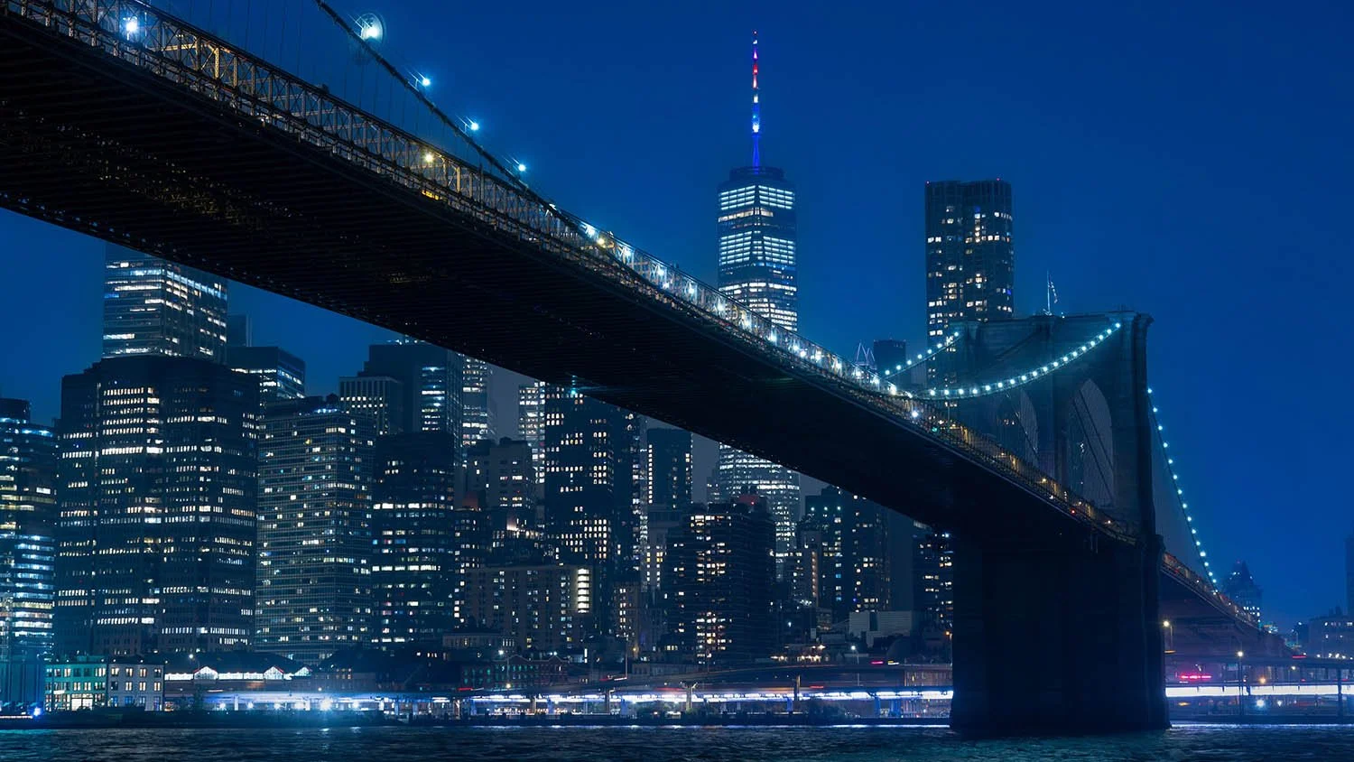 Brooklyn Bridge with NYC skyline at night