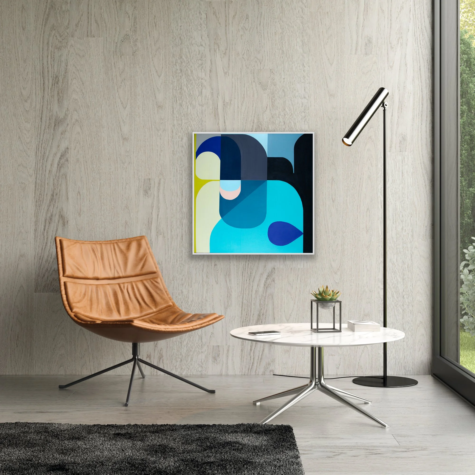 A modern design home setting with coffee table, chair and reading lamp showing artwork by abstract contemporary painter Marion Griese.