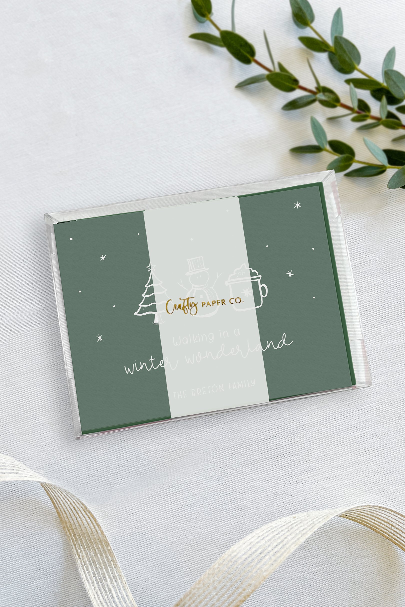 Whimsical Christmas note cards gift-ready packaging.