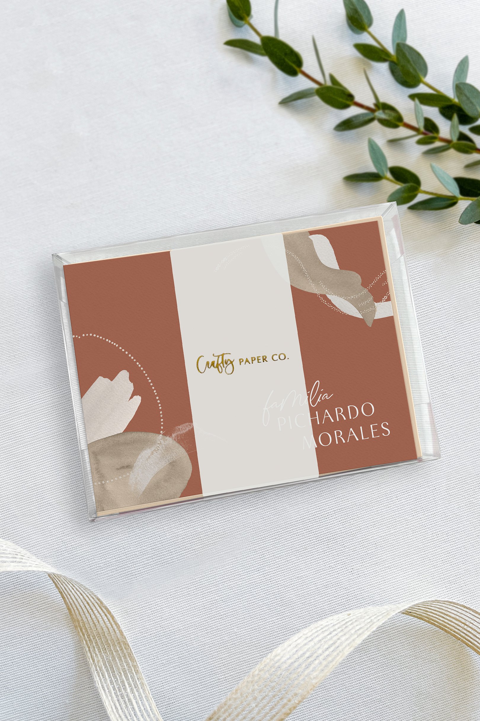 Abstract Terracotta folded notecards gift-ready packaging.