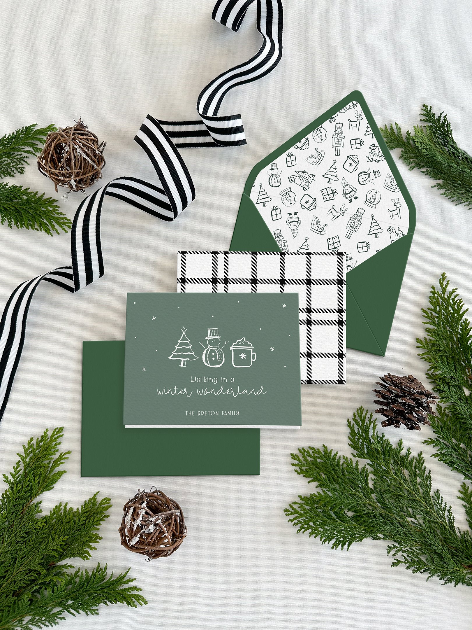 Whimsical Christmas folded notecards set with coordinating envelopes and printed envelope liners.