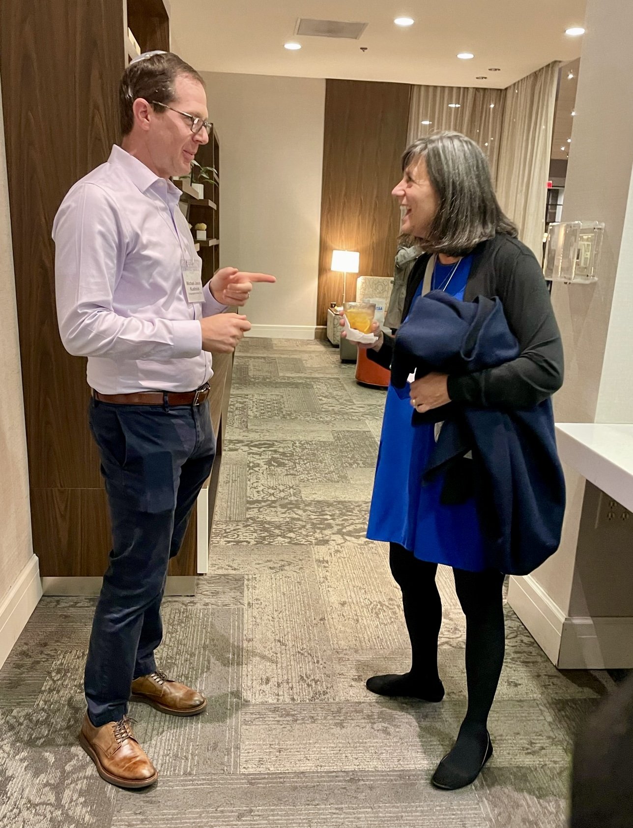  Rabbi Michael Kushnick from Anshai Torah in Plano, TX and Suzy Wexler from BJBE in Deerfield, IL talk during pre-dinner cocktails. 