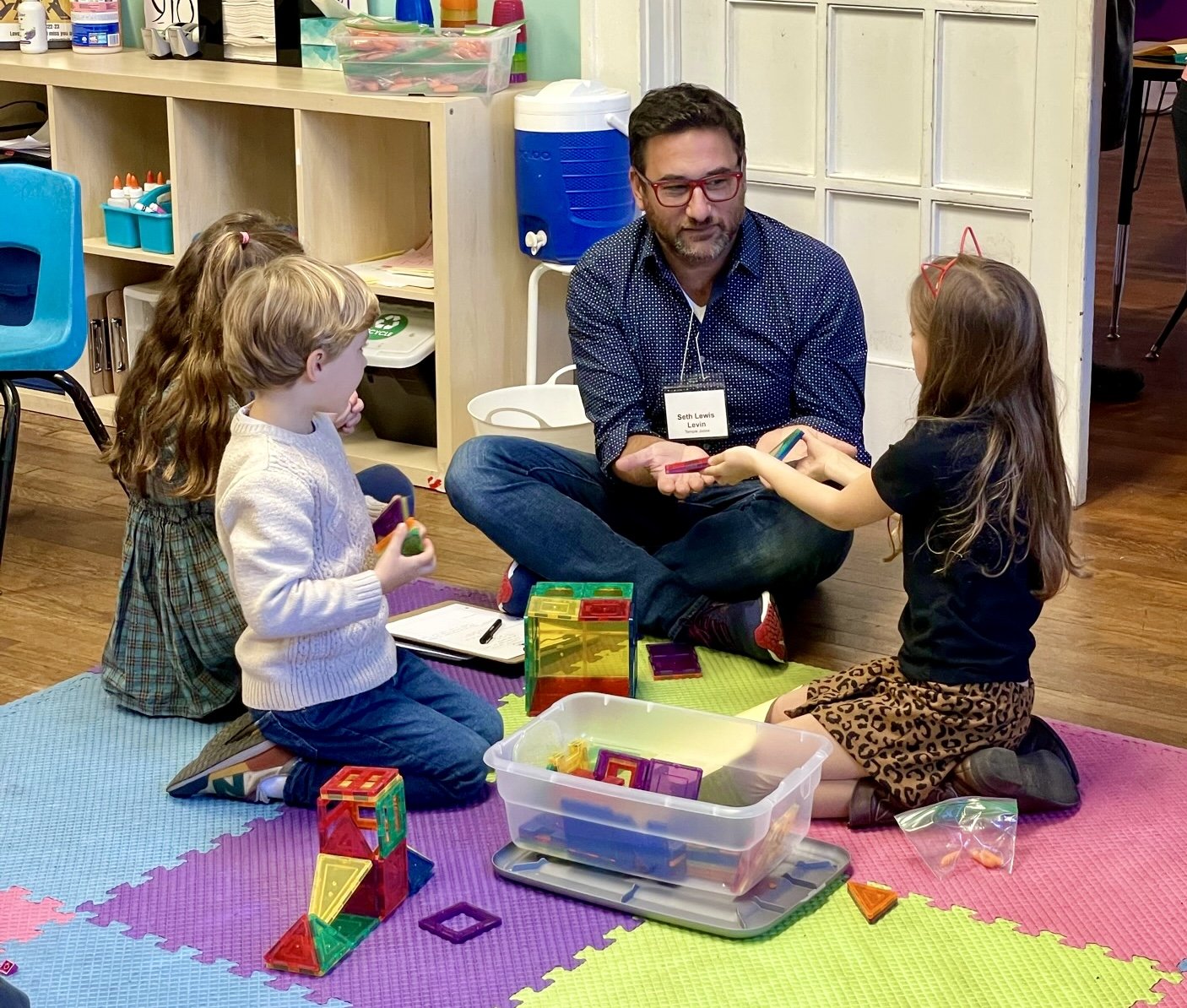  Seth Lewis Levin from Temple Judaea in Coral Gables spends time with students in JKG’s Atlanta Jewish after-school program. 