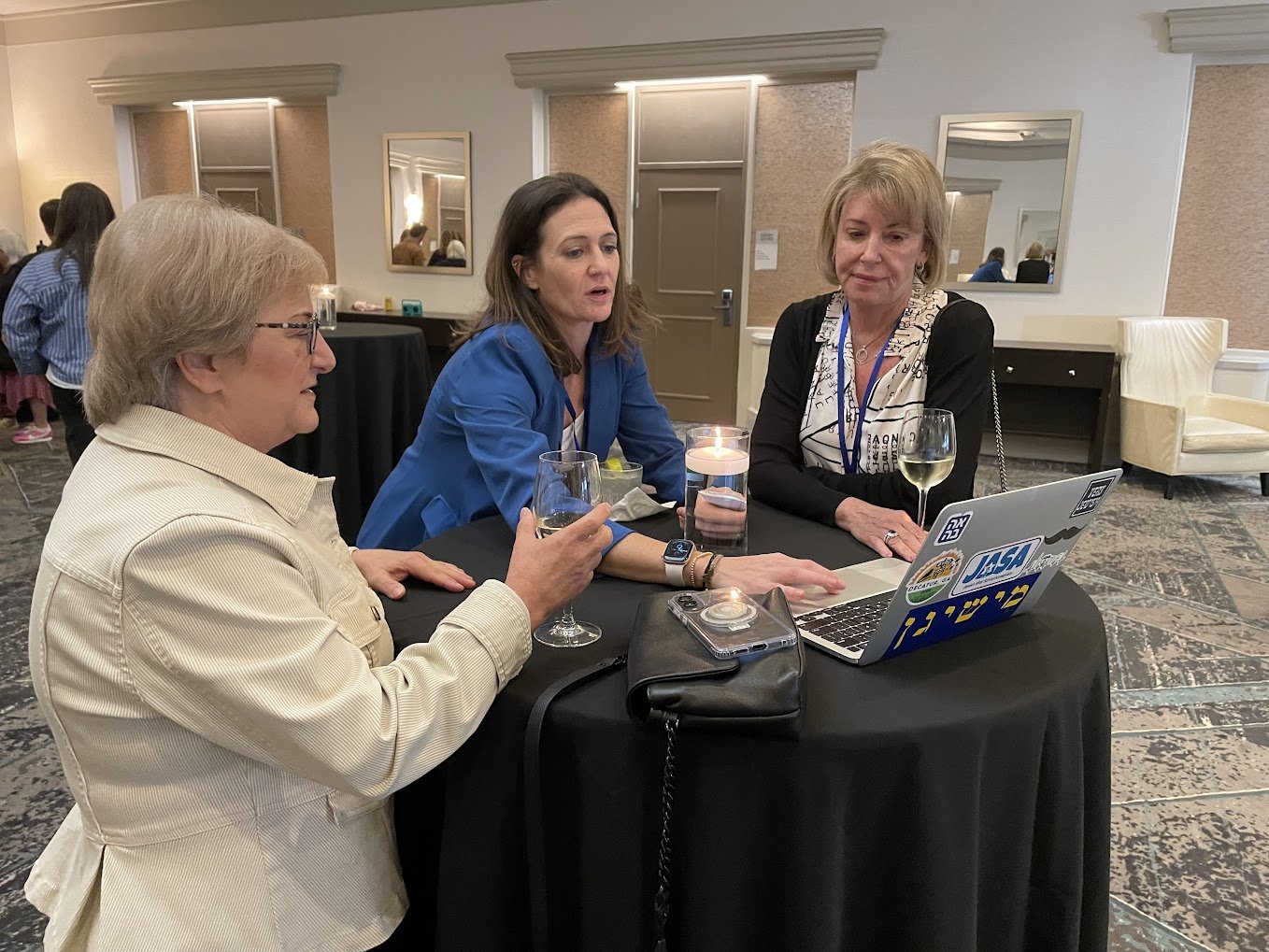 Rachel Dobbs Schwartz, JKG's CIO, engages over drinks