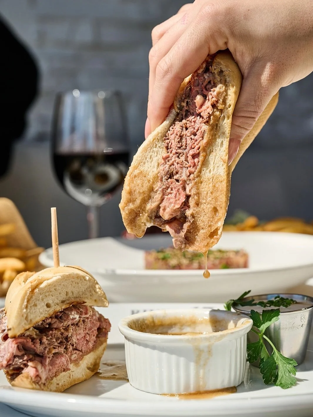 drop in anytime🌞

Prime Rib Sandwich
thin-sliced prime rib, horseradish cream, provolone, onion straws, au jus, @ontheriseartisanbread baguette, french fries