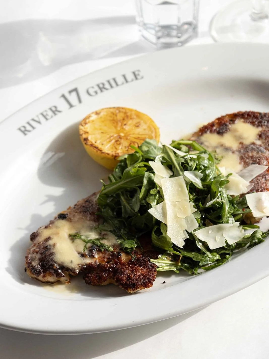 A house specialty for a reason.⁠
⁠
Lemon Parmesan Chicken 🍋⁠
pan-seared crispy chicken, beurre blanc, arugula salad, lemon vinaigrette⁠
⁠